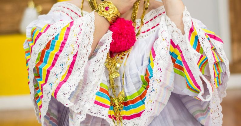 Folklore - Selective Focus Photography of Woman Holding Floral Hairpiece