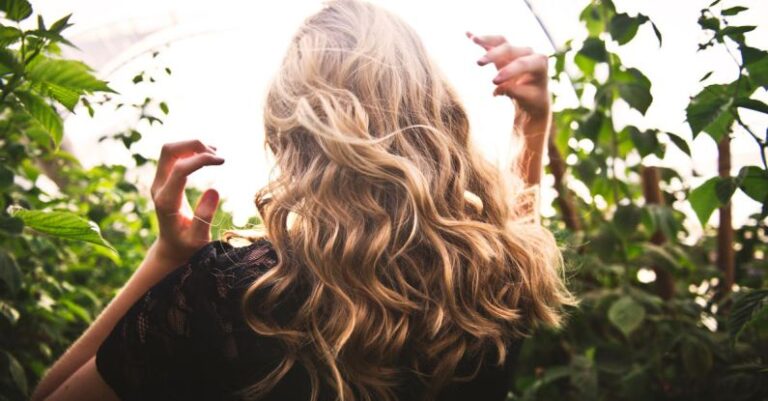 Highlights - Blonde-haired Woman Standing Between Green Plants