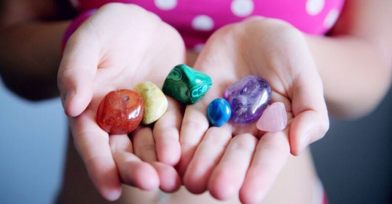 Gems - Woman Holding Six Polished Stones