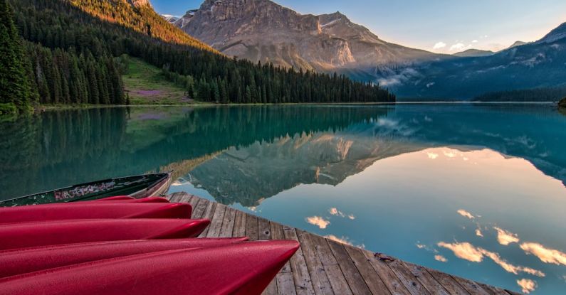 Landscapes - Red Canoes on Sea Dock Near Calm Body of Water