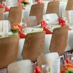 Events - Long Tables With White Cloths and Brown Chairs Formal Setting