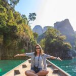 Tours - Photo of Woman Sitting on Boat Spreading Her Arms