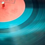 Music - Blue Vinyl Record Playing on Turntable